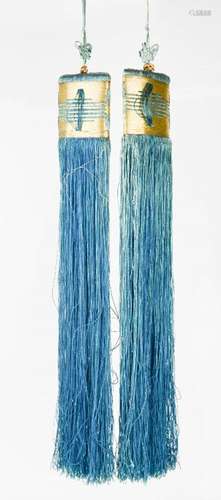 A pair of Chinese silk tassels, in blue and gold, 51cm long.