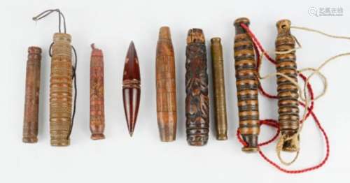 A group of 19th century Chinese treen needle cases, included carved examples, one red lacquered