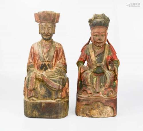 A pair of 19th century carved figures of Chinese Ancestors, retaining original residual