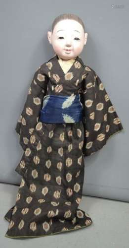An Itchimatsu doll, late Meiji period (1868-1910), wearing hakama and haori, 61cm long. [Ichimatsu