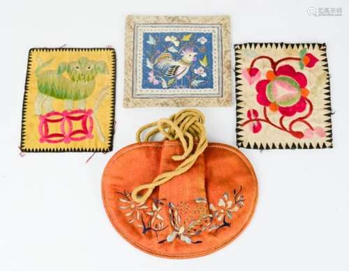 A Chinese silk purse with holding chords, and embroidered with butterflies symbolising happiness,