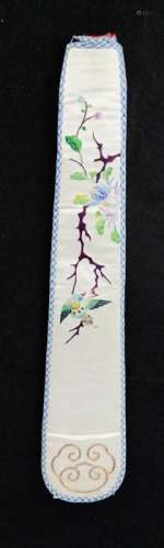 A Chinese silk fan case circa 1920, hand embroidered to depict a bird perched upon a branch, 30cm