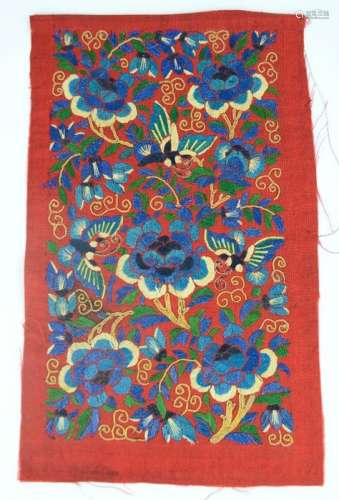 A Chinese embroidered skirt panel, 'San Lan' three blues on red ground, depicting butterflies and