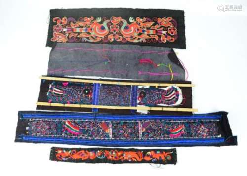 A group of embroidered Miao minority panels from Southern China.