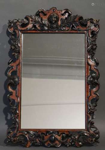 Miroir en bois sculpté. 75x48 cm