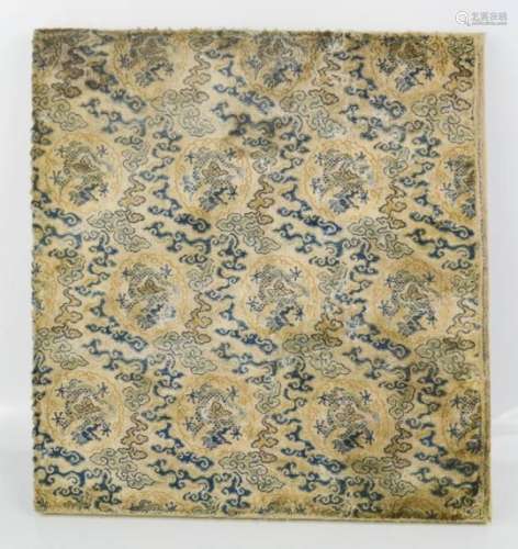 An 18th century Chinese silk brocade panel, depicting dragon medallions amongst clouds, 31 by 32cm.