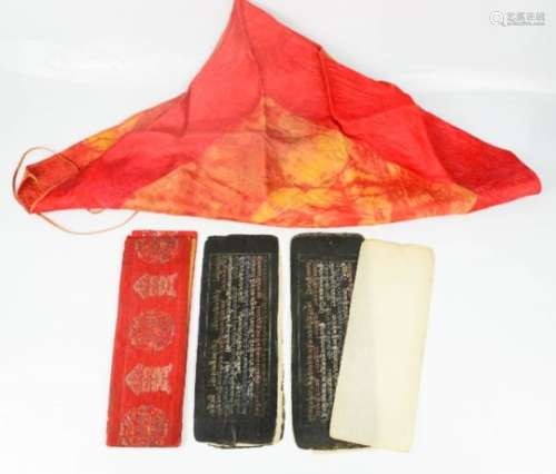 A Sutra (religious book) and cover, Buddhist ex-Tibet, with 18th century textile to cover the