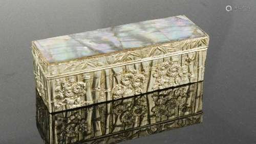 A Chinese mother of pearl and silvered metal box, cast with bamboo and peonies, 9cm long.