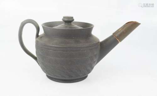 A Chinese black stoneware teapot, 7½cm high.