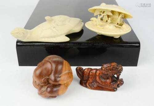 A group of Chinese carvings including dragon, turtle, clam shell.