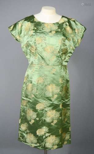 A 20th century Chinese green silk dress depicting peonies.