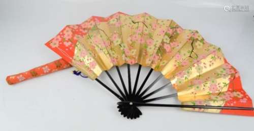 A 20th century Chinese fan, gilded and decorated with peonies.
