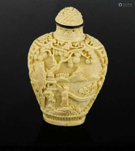 A Chinese carved snuff bottle carved with landscape.