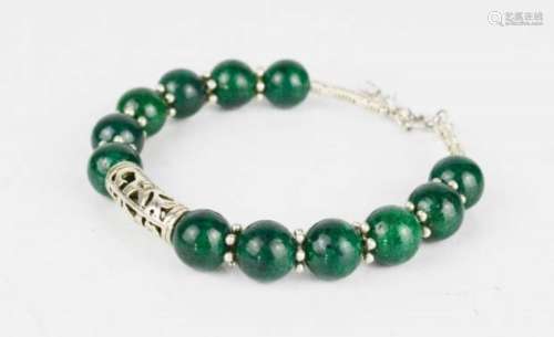 A Chinese green jade beaded bangle with Miau silver clasp.