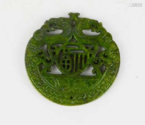 A Chinese natural heitian green jade carved medallion pendant./