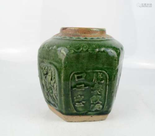 A Chinese hexagonal jar, stoneware with green glaze, and panels of calligraphy to each side, 14cm
