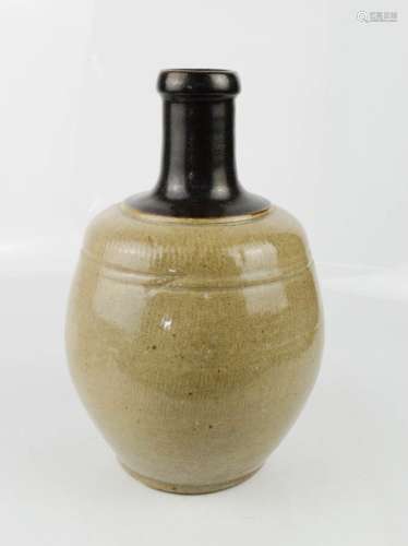 A 20th century stone ware glazed Chinese jar.