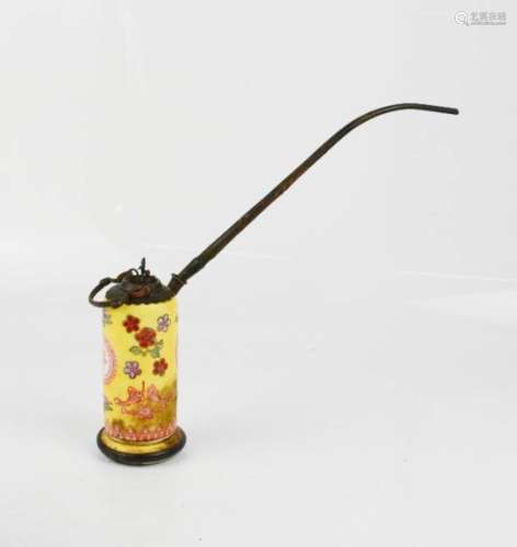 An early 19th century Chinese opium pipe, yellow ground with red calligraphy, 10m high.