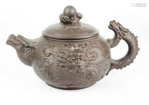 A Chinese purple clay teapot.
