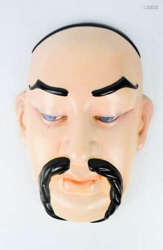 A Beswick ceramic Chinese face mask wall hanging, stamped Beswick verso.