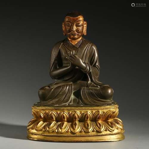 TIBETAN PARTLY GILT BRONZE SEATED GURU