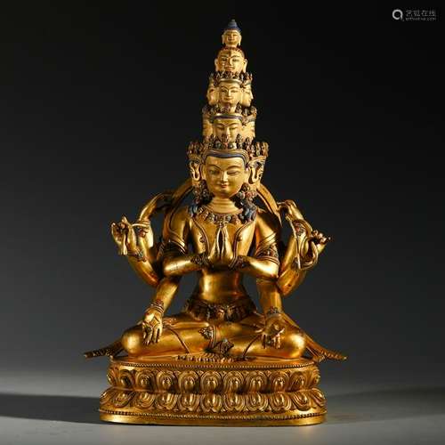 TIBETAN GILT BRONZE SEATED ELEVEEN FACE GUANYIN