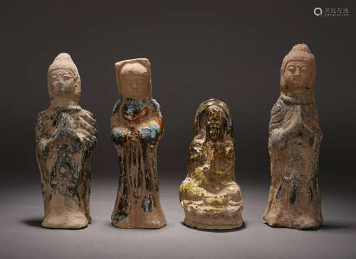 FOUR CHINESE POTTERY STANDING BUDDHA