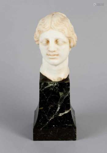 Female marble head in ancient manner. White marble, finely sculpted with waved hairs on later
