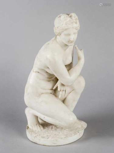 Marble Sculpture of the crouching Venus after the ancient on round base sitting on a shell. White