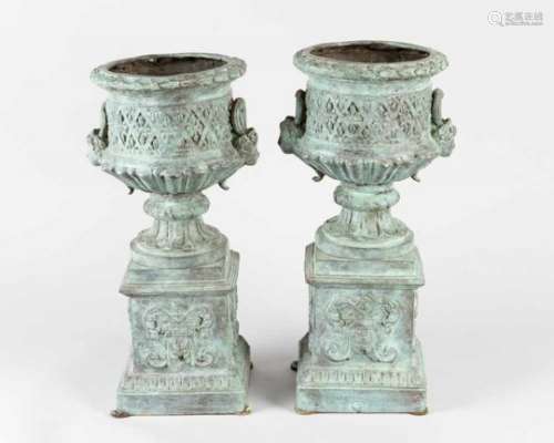 Pair of bronze urn vases on quadratic bases with thinner central and round upper bowl with maidens