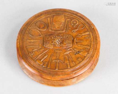 Powder Box, round shape, from root wood, on top carved wine tools and a wine barrel. Signed “Morel