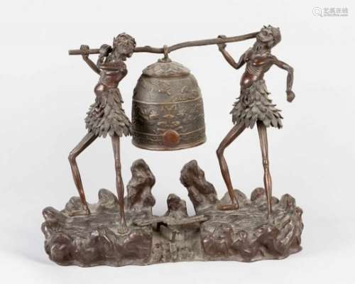 Meiji Bronze, with two grotesque men holding a large bell on naturalistic base, bronze cast with