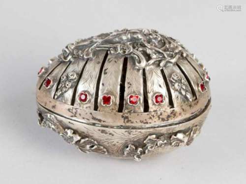 Russian silver egg. Egg-shape with open work lid. In the centre a elegant lady with flowers