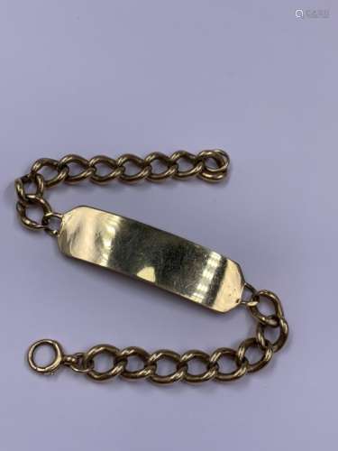 A 9ct GOLD ID BRACELET DATED 1987. WEIGHT 34.4grms.