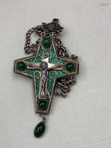 A GREEK ORTHODOX WHITE METAL ARTICUALTED CRUCIFIX INSET WITH GREEN CABOCHON STONES AND BACKED WITH