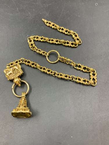 A YELLOW METAL FANCY LINK DOUBLE WATCH ALBERT WITH SEALING FOB AND HORSE MOTIF HOLDER. TOTAL