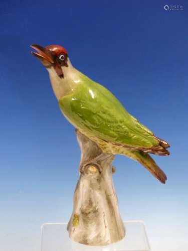 A MEISSEN FIGURE OF A GREEN WOODPECKER PERCHED ON A GREY TREE STUMP, CROSSED SWORDS MARK. H 27cms.