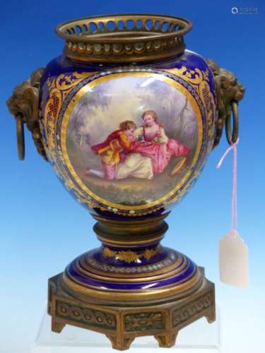A SEVRES STYLE ORMOLU MOUNTED OIL LAMP BASE PAINTED ON ONE SIDE OF THE LION MASK AND RING HANDLES