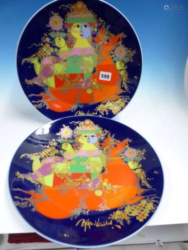 TWO BJORN WIINBLAD ROSENTHAL DISHES EACH WITH A COLOURFUL FIGURE ON A HORSE AGAINST A BLUE GROUND.