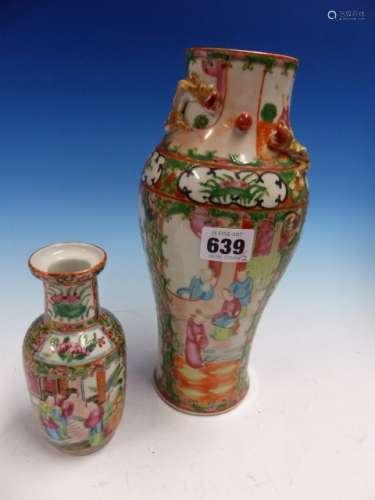 TWO CANTON VASES BOTH PAINTED WITH FIGURE AND GARDEN RESERVES, THE LARGER OF BALUSTER SHAPE. H 26.