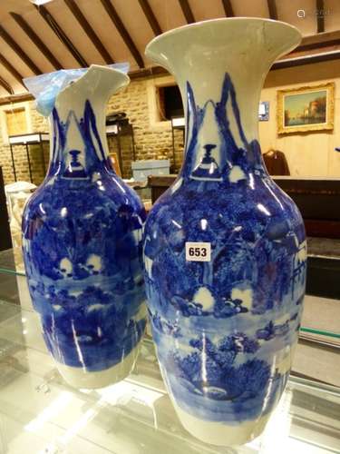 A PAIR OF JAPANESE BLUE AND WHITE BALUSTER VASES PAINTED WITH MOUNTAINOUS ISLAND LANDSCAPES. H