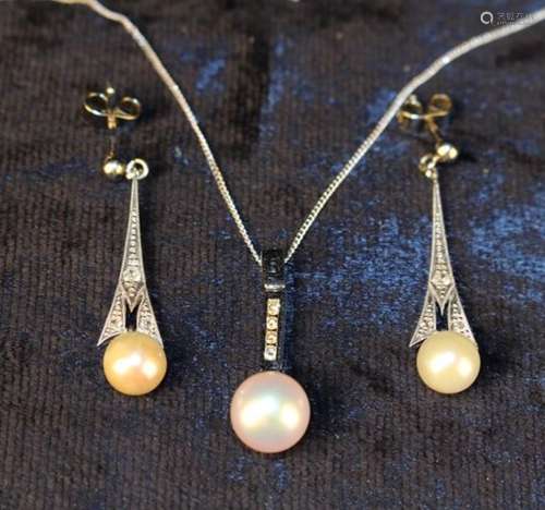 A Pearl Pendant on an 18 Carat white gold mount set with four small diamonds and hanging from a 9