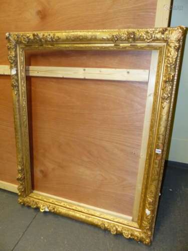 A LARGE ANTIQUE FRENCH STYLE GILT PICTURE FRAME. REBATE 91 x 116cms.