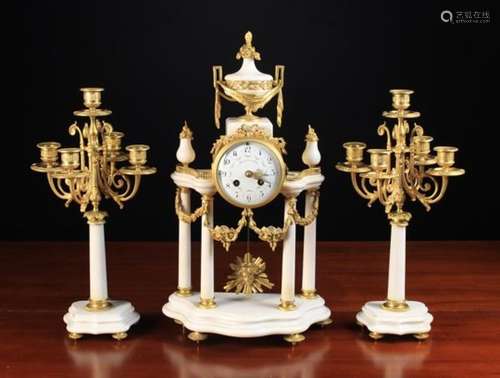 A Louis XVI Style White Marble & Gilt Bronze Clock Set.