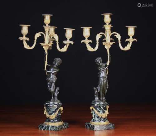 A Pair of 19th Century Figural Bronze Candelabra after Clodion.