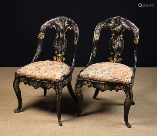 A Pair of Victorian Black Lacquered Papier mâché Chairs elaborately decorated with butterflies and