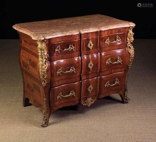 A Small 19th Century Marble-topped Serpentine Front Commode in the Louis XV Style.