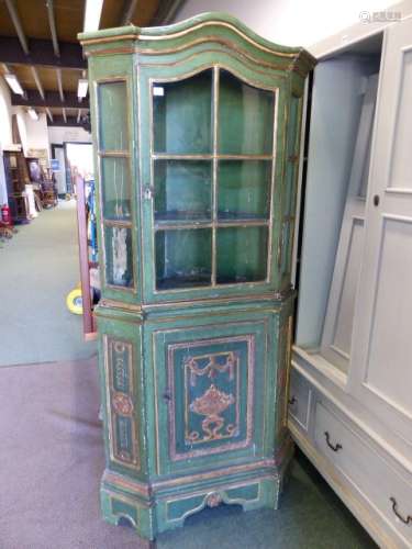 A 19th C. FRENCH GREEN PAINTED PINE CORNER CUPBOARD, THE UPPER HALF GLAZED BELOW THE SERPENTINE CORN