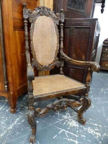 AN EARLY 20th.C.CAROLEAN STYLE WALNUT ARMCHAIR WITH CANE BACK AND SEAT.