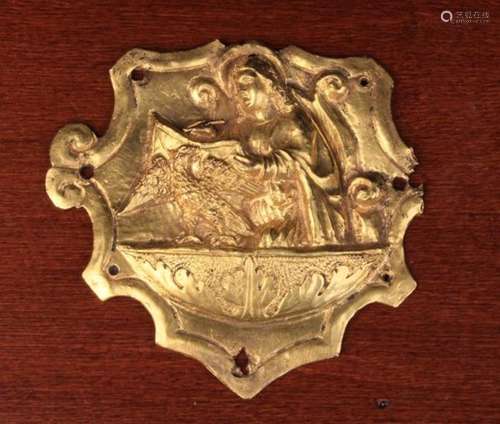 A Late Mediaeval Gilt Bronze Cartouche Plaque embossed with Saint John the Evangelist with eagle,